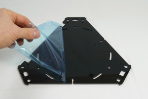 All acrylic parts are covered by a protective film, on both sides. Always remove this before assembly