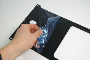 Remove the protective film from the acrylic panel.
