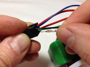  Put the pins on the ends of the wires into the six-way female socket. 
