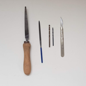 Tools for adjusting plastic parts, if necessary